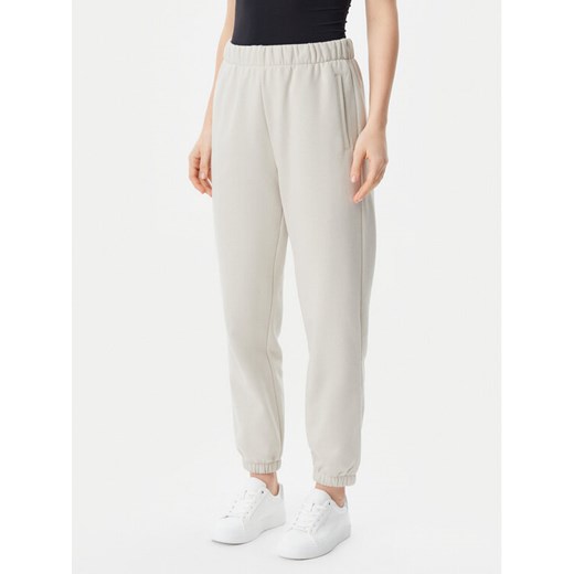 Gap Spodnie dresowe 765568-03 Beżowy Relaxed Fit ze sklepu MODIVO w kategorii Spodnie damskie - zdjęcie 182700020