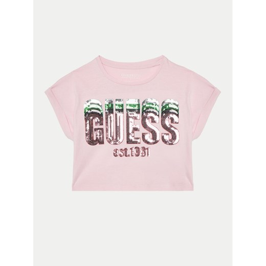 Guess T-Shirt J5RI10 K8HM4 Różowy Regular Fit ze sklepu MODIVO w kategorii Bluzki dziewczęce - zdjęcie 182700984