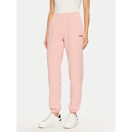 Guess Spodnie dresowe V5RB02 KCLD1 Różowy Regular Fit ze sklepu MODIVO w kategorii Spodnie damskie - zdjęcie 182704533