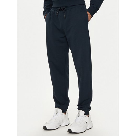 Armani Exchange Spodnie dresowe 6DZPJM ZJADZ 1510 Granatowy Regular Fit ze sklepu MODIVO w kategorii Spodnie męskie - zdjęcie 182705463