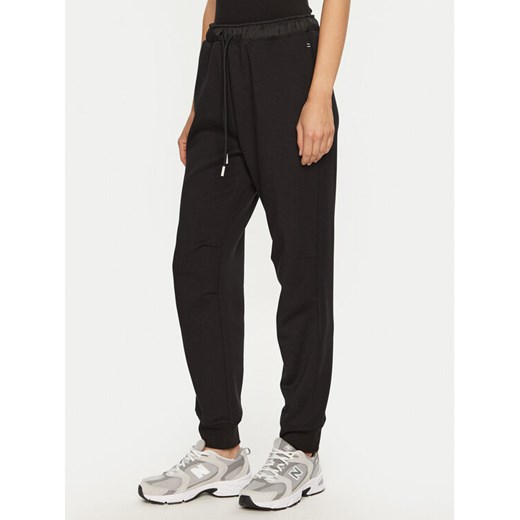 Champion Spodnie dresowe 117477 Czarny Slim Fit ze sklepu MODIVO w kategorii Spodnie damskie - zdjęcie 182705893