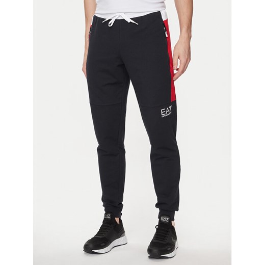 EA7 Emporio Armani Spodnie dresowe 3DPP66 PJLIZ 1578 Granatowy Regular Fit ze sklepu MODIVO w kategorii Spodnie męskie - zdjęcie 182706254
