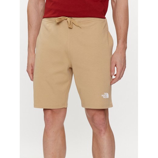 The North Face Szorty sportowe Graphic NF0A3S4F Beżowy Regular Fit ze sklepu MODIVO w kategorii Spodenki męskie - zdjęcie 182706540