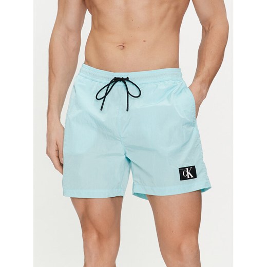 Calvin Klein Swimwear Szorty kąpielowe KM0KM00980 Niebieski Regular Fit ze sklepu MODIVO w kategorii Kąpielówki - zdjęcie 182707873