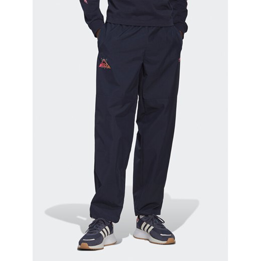 adidas Spodnie dresowe Adventure Ride HK4979 Granatowy Loose Fit ze sklepu MODIVO w kategorii Spodnie męskie - zdjęcie 182708304