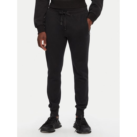 Dolce&Gabbana Spodnie dresowe GVXQHT G7F2G Czarny Regular Fit ze sklepu MODIVO w kategorii Spodnie męskie - zdjęcie 182708384