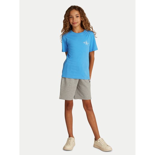 Calvin Klein Jeans T-Shirt IU0IU00678 Niebieski Regular Fit ze sklepu MODIVO w kategorii Bluzki dziewczęce - zdjęcie 182708643