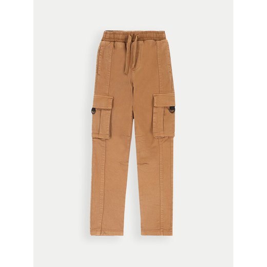 Coccodrillo Spodnie materiałowe ZC4119101FBJ Brązowy Slim Fit ze sklepu MODIVO w kategorii Spodnie dziewczęce - zdjęcie 182709110
