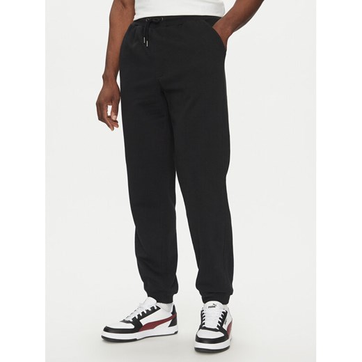 Quiksilver Spodnie dresowe Salt Water EQYFB03391 Czarny Regular Fit ze sklepu MODIVO w kategorii Spodnie męskie - zdjęcie 182710633