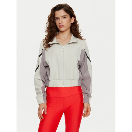 Under Armour Wiatrówka UA Unstoppable Crop 1386479 Écru Regular Fit ze sklepu MODIVO w kategorii Kurtki damskie - zdjęcie 182711301