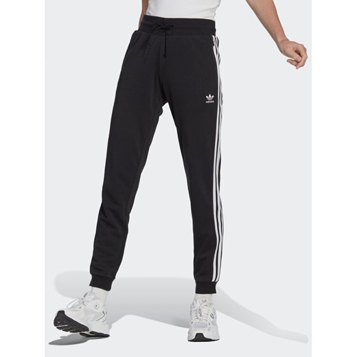 adidas Spodnie dresowe Adicolor Classics Slim Cuffed Joggers IB7455 Czarny Slim Fit ze sklepu MODIVO w kategorii Spodnie męskie - zdjęcie 182711442