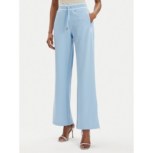 Juicy Couture Spodnie dresowe Kurt JCSBJ224418 Błękitny Regular Fit ze sklepu MODIVO w kategorii Spodnie damskie - zdjęcie 182711964