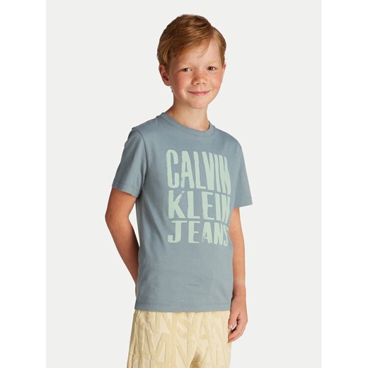 Calvin Klein Jeans T-Shirt Slogan Graphic IB0IB02459 Niebieski Regular Fit ze sklepu MODIVO w kategorii T-shirty chłopięce - zdjęcie 182712464