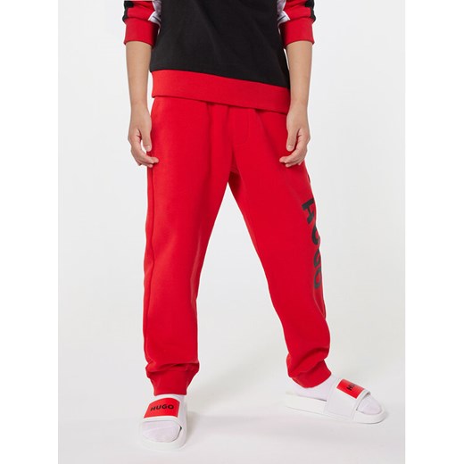 Hugo Spodnie dresowe G00042 S Czerwony Regular Fit ze sklepu MODIVO w kategorii Spodnie chłopięce - zdjęcie 182713014
