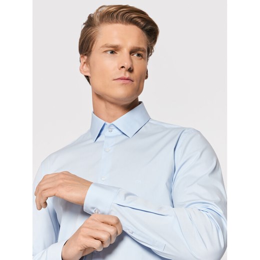Calvin Klein Koszula Poplin K10K108229 Niebieski Slim Fit ze sklepu MODIVO w kategorii Koszule męskie - zdjęcie 182714293