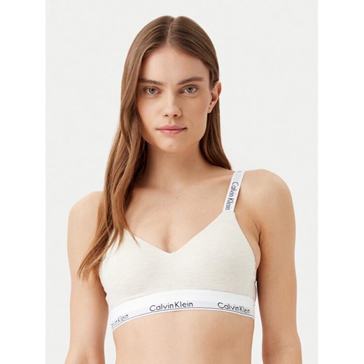 Calvin Klein Underwear Biustonosz bezfiszbinowy 000QF7059E Beżowy ze sklepu MODIVO w kategorii Biustonosze - zdjęcie 182714732