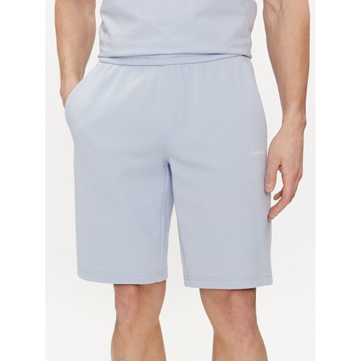 Calvin Klein Szorty sportowe Micro Logo K10K111208 Niebieski Regular Fit ze sklepu MODIVO w kategorii Spodenki męskie - zdjęcie 182718322