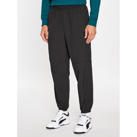Puma Spodnie dresowe Classics Utility 622668 Czarny Regular Fit ze sklepu MODIVO w kategorii Spodnie męskie - zdjęcie 182719533
