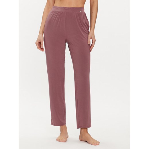 Calvin Klein Underwear Spodnie dresowe 000QS7145E Różowy Relaxed Fit ze sklepu MODIVO w kategorii Spodnie damskie - zdjęcie 182720384