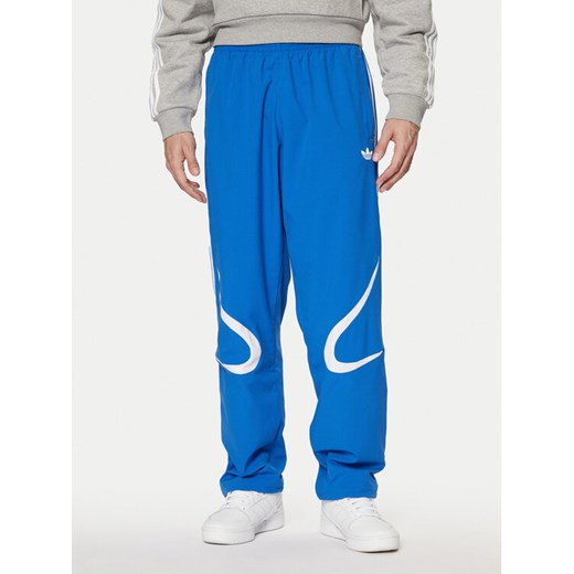 adidas Spodnie dresowe adicolor Teamgeist JP1120 Niebieski Regular Fit ze sklepu MODIVO w kategorii Spodnie męskie - zdjęcie 182721463