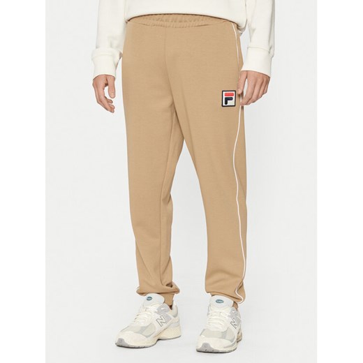 Fila Spodnie dresowe Lincoln FAM0663 Beżowy Regular Fit ze sklepu MODIVO w kategorii Spodnie męskie - zdjęcie 182722423