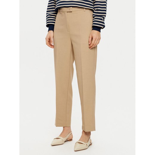 Tommy Hilfiger Chinosy WW0WW44090 Beżowy Regular Fit ze sklepu MODIVO w kategorii Spodnie damskie - zdjęcie 182723721