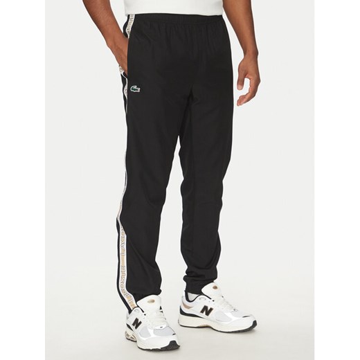 Lacoste Spodnie dresowe XH8974 Czarny Relaxed Fit ze sklepu MODIVO w kategorii Spodnie męskie - zdjęcie 182729860