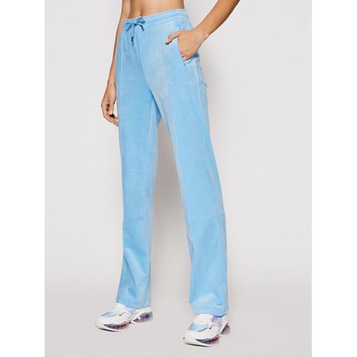 Juicy Couture Spodnie dresowe Tina JCAPW045 Błękitny Regular Fit ze sklepu MODIVO w kategorii Spodnie damskie - zdjęcie 182730251