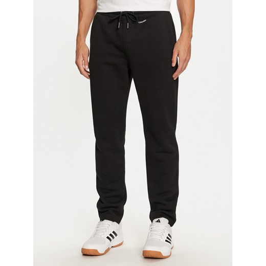 Calvin Klein Spodnie dresowe K10K113654 Czarny Regular Fit ze sklepu MODIVO w kategorii Spodnie męskie - zdjęcie 182731652