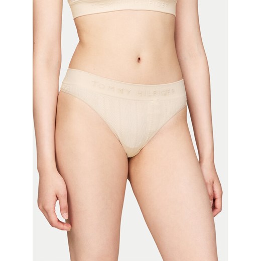 Tommy Hilfiger Stringi UW0UW05503 Beżowy ze sklepu MODIVO w kategorii Majtki damskie - zdjęcie 182737001