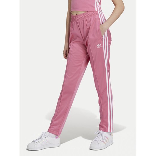 adidas Spodnie dresowe Trefoil IY4032 Różowy Regular Fit ze sklepu MODIVO w kategorii Spodnie dziewczęce - zdjęcie 182737010