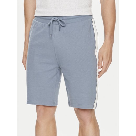 Tommy Hilfiger Szorty sportowe UM0UM03008 Niebieski Regular Fit ze sklepu MODIVO w kategorii Spodenki męskie - zdjęcie 182737464