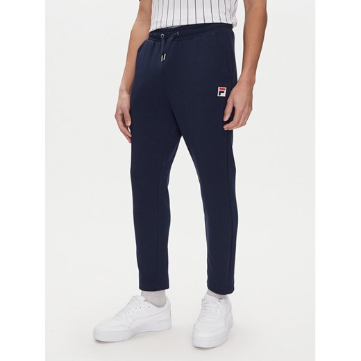 Fila Spodnie dresowe Lobbes FAM0922 Granatowy Tapered Fit ze sklepu MODIVO w kategorii Spodnie męskie - zdjęcie 182737842