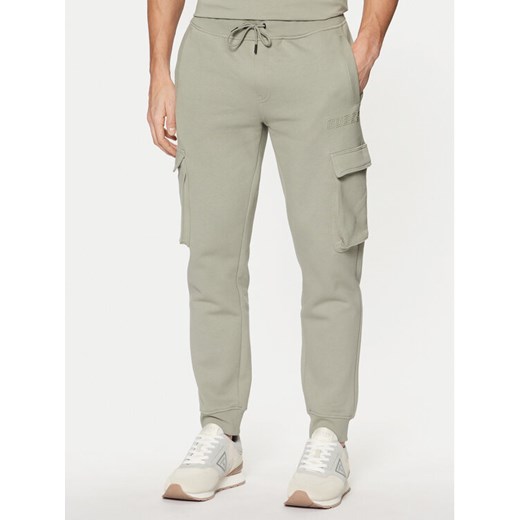 Guess Spodnie dresowe Z4YB08 K9V31 Zielony Regular Fit ze sklepu MODIVO w kategorii Spodnie męskie - zdjęcie 182738752