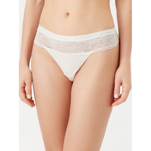 Calvin Klein Underwear Stringi 000QF7980E Écru ze sklepu MODIVO w kategorii Majtki damskie - zdjęcie 182739831