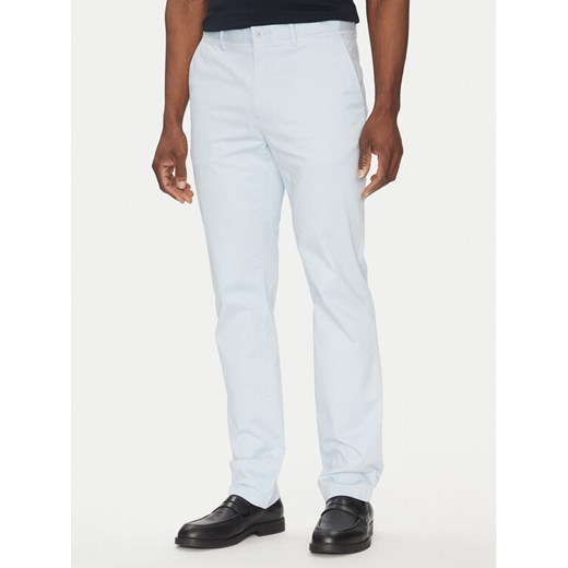 Tommy Hilfiger Chinosy Deton MW0MW37873 Błękitny Slim Fit ze sklepu MODIVO w kategorii Spodnie męskie - zdjęcie 182741442