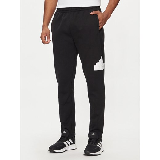 adidas Spodnie dresowe Future Icons IN3322 Czarny Regular Fit ze sklepu MODIVO w kategorii Spodnie męskie - zdjęcie 182742071