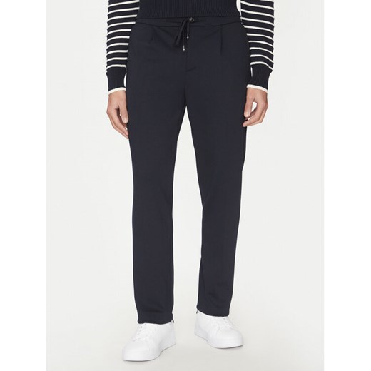 Tommy Hilfiger Spodnie materiałowe Punto MW0MW39197 Granatowy Regular Fit ze sklepu MODIVO w kategorii Spodnie męskie - zdjęcie 182744143