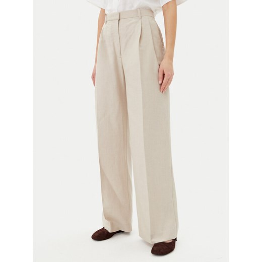 Tommy Hilfiger Spodnie materiałowe WW0WW45460 Beżowy Relaxed Fit ze sklepu MODIVO w kategorii Spodnie damskie - zdjęcie 182744874