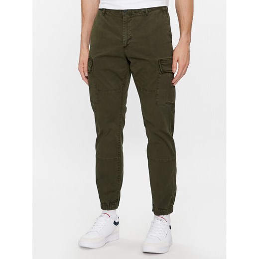 Tommy Hilfiger Joggery Chelsea MW0MW31149 Khaki Relaxed Fit ze sklepu MODIVO w kategorii Spodnie męskie - zdjęcie 182744880