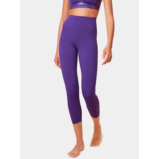Triumph Legginsy Cardio RTW 7/8 High Waist Leggings Logo 10215957 Fioletowy Slim Fit ze sklepu MODIVO w kategorii Spodnie damskie - zdjęcie 182747390