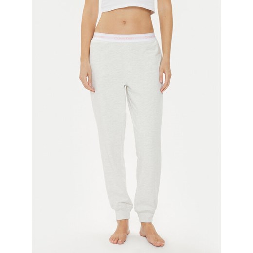 Calvin Klein Underwear Spodnie dresowe 000QS6872E Różowy Relaxed Fit ze sklepu MODIVO w kategorii Spodnie damskie - zdjęcie 182750061