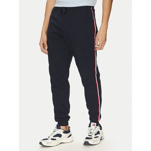 Tommy Hilfiger Spodnie dresowe Global Stripe MW0MW38696 Granatowy Regular Fit ze sklepu MODIVO w kategorii Spodnie męskie - zdjęcie 182750904
