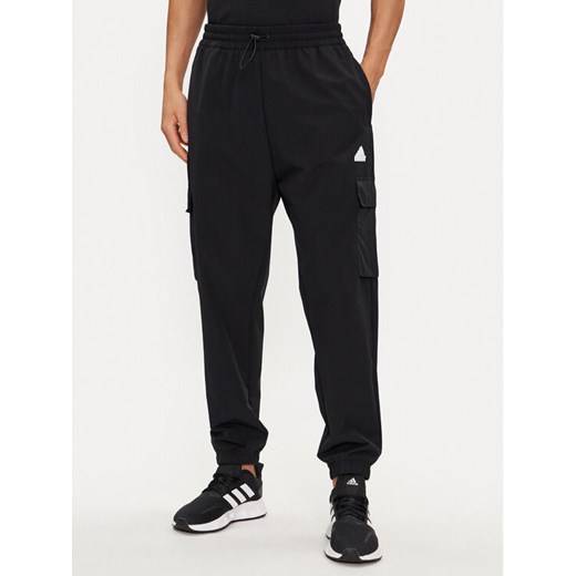 adidas Spodnie dresowe City Escape IR5179 Czarny Regular Fit ze sklepu MODIVO w kategorii Spodnie męskie - zdjęcie 182751413