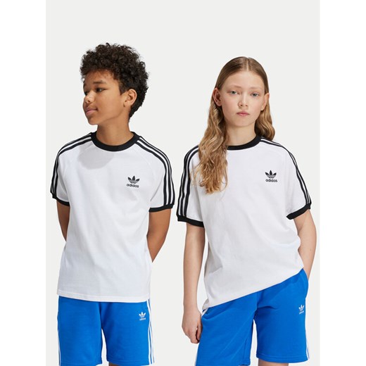 adidas T-Shirt 3-Stripes JE0515 Biały Regular Fit ze sklepu MODIVO w kategorii Bluzki dziewczęce - zdjęcie 182752473