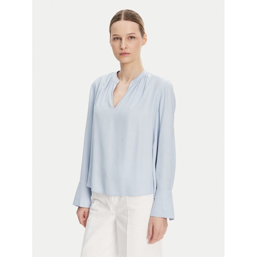 Tommy Hilfiger Bluzka WW0WW44049 Błękitny Regular Fit ze sklepu MODIVO w kategorii Bluzki damskie - zdjęcie 182754014