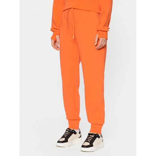 Lacoste Spodnie dresowe XF0343 Pomarańczowy Regular Fit ze sklepu MODIVO w kategorii Spodnie damskie - zdjęcie 182754264
