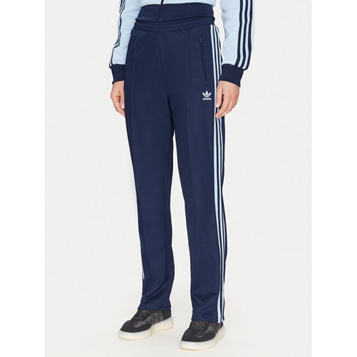 adidas Spodnie dresowe Beckenbauer JC5793 Granatowy Regular Fit ze sklepu MODIVO w kategorii Spodnie damskie - zdjęcie 182757042