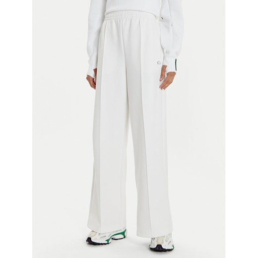 Lacoste Spodnie dresowe XF7374 Biały Wide Leg ze sklepu MODIVO w kategorii Spodnie damskie - zdjęcie 182758034