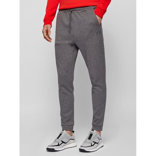 Boss Spodnie dresowe Hadiko 50441275 Szary Regular Fit ze sklepu MODIVO w kategorii Spodnie męskie - zdjęcie 182758583